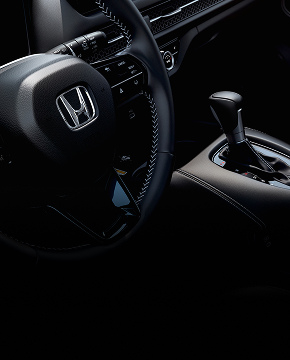 Honda steering wheel with contrast stitching and gear shift console. Honda steering wheel with contrast stitching and gear shift console.